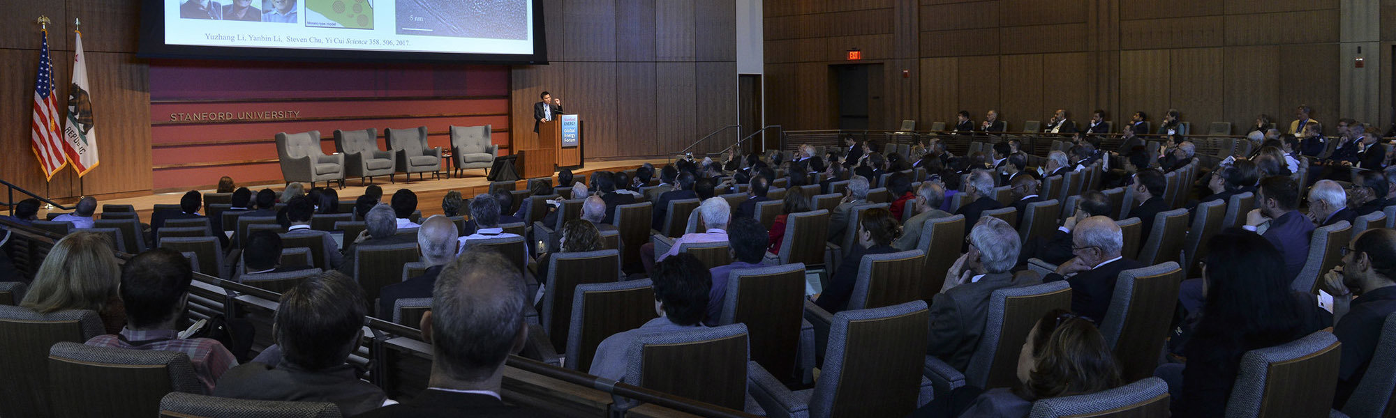 Yi Cui speaking in front of audience at the Global Energy Forum 2018