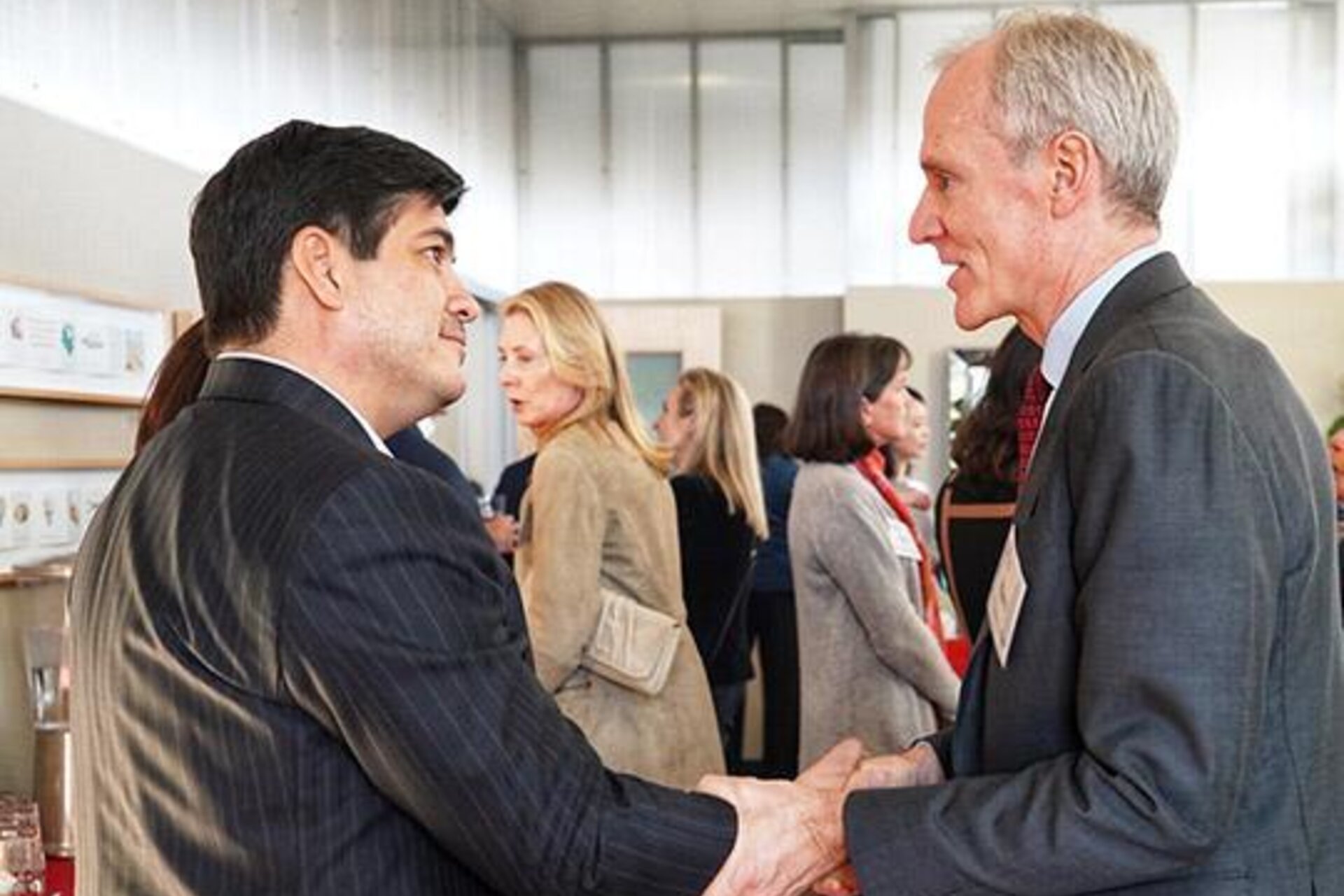 Stanford President Marc Tessier-Lavigne greets President Alvarado in a pre-event reception.