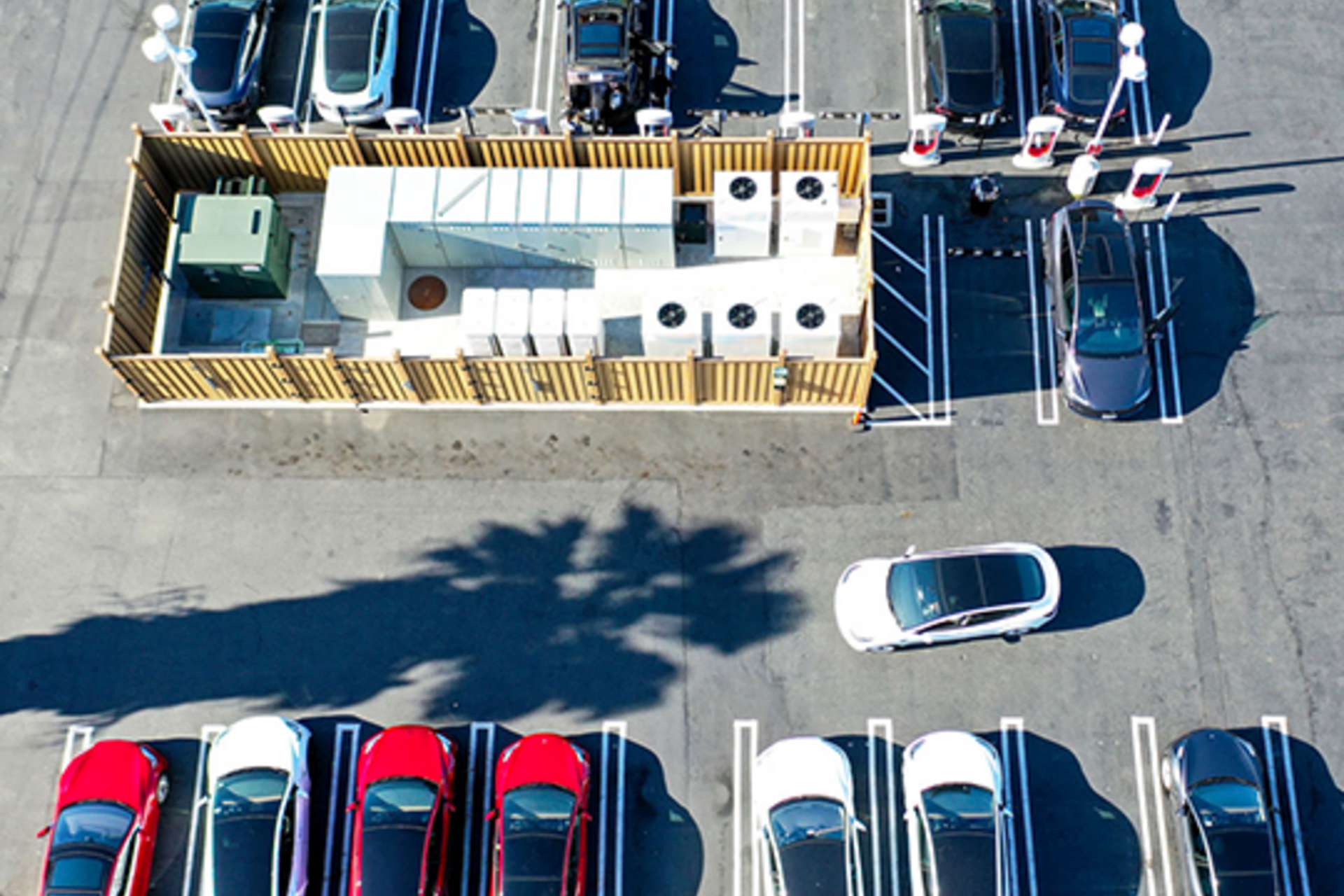 bird's-eye view of electric vehicles at charging stations