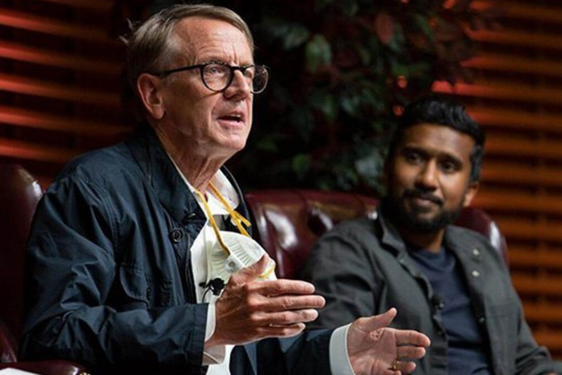 John Doerr on stage at Stanford GSB, talking to an audience about his plan for climate action. Photo by Saul Bromberger
