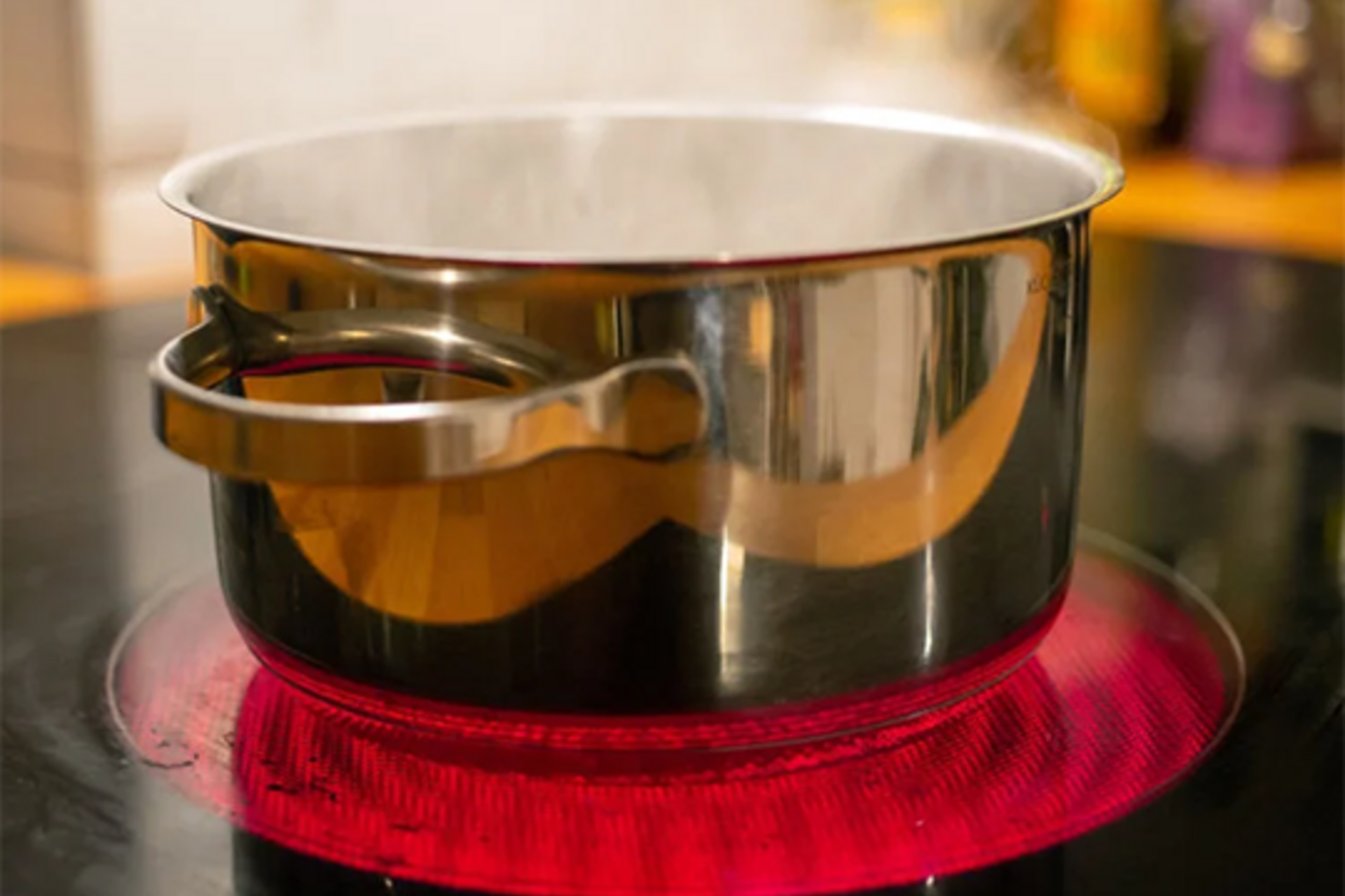 A saucepan of boiling water sits on an induction hob in a kitchen in Berlin, Germany on August 27, 2021. (Fernando Gutierrez-Juarez/picture alliance—Getty Images)