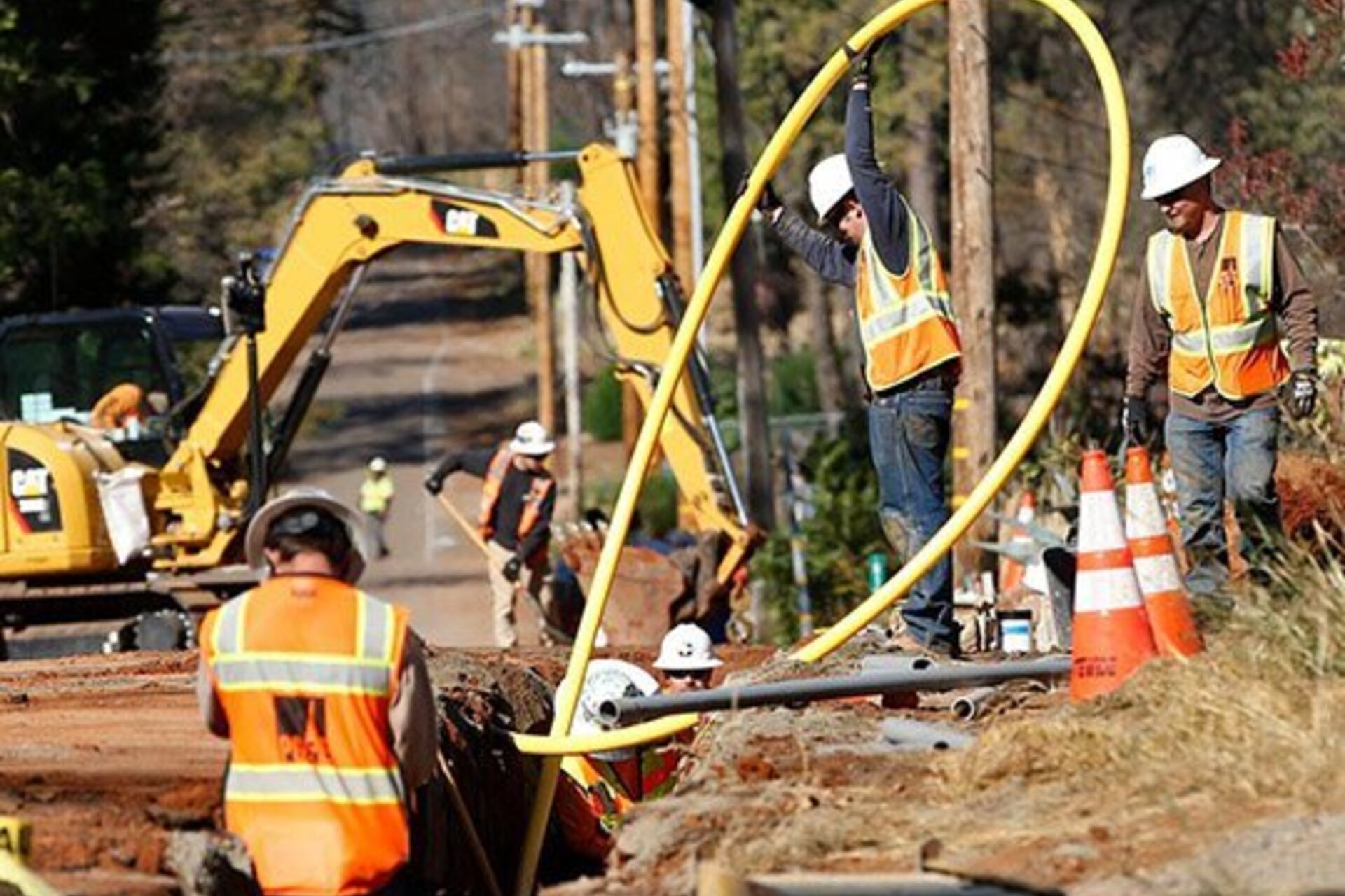 PG&E workmen bury utility lines in Paradise, Calif., Oct. 18.