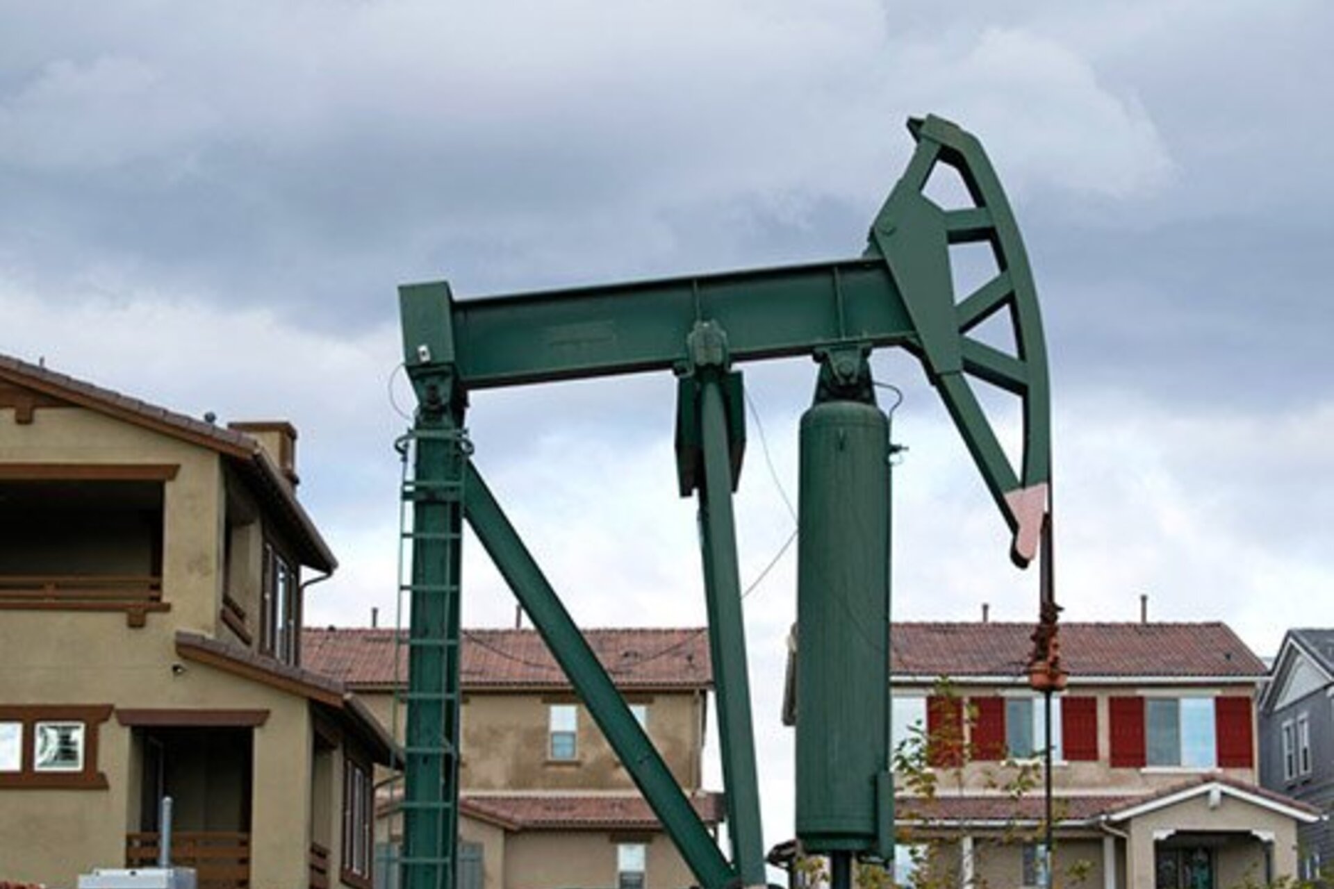 A pumpjack near residential homes