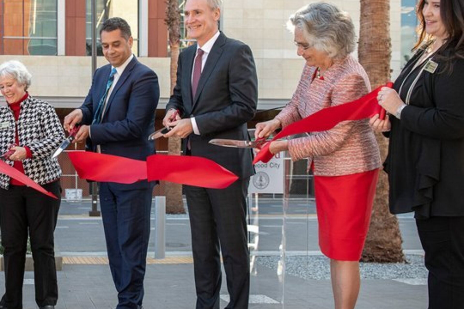 Persis Drell and Marc Tessier-Lavigne cutting a ribbon at an opening ceremony