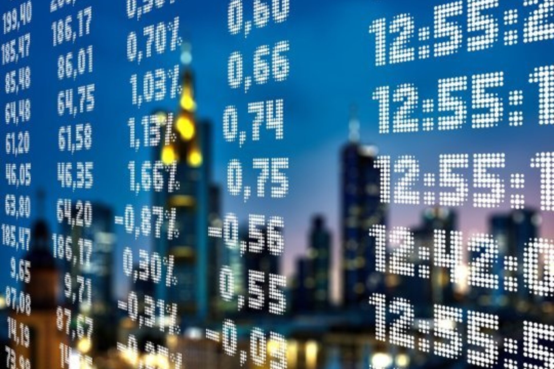A stock exchange data screen that has been cleaned very well so the glass is reflecting a city during dusk