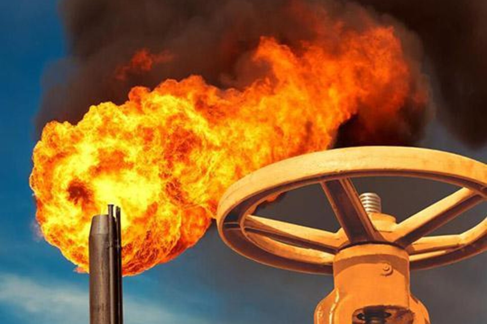 A large, bright burst of flame by a metal wheel