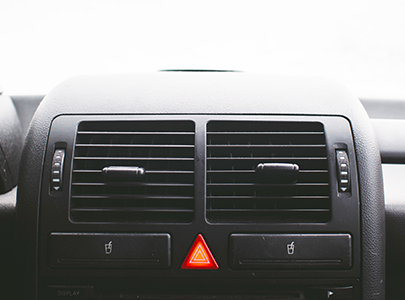 The center of a car dashboard with two air vents