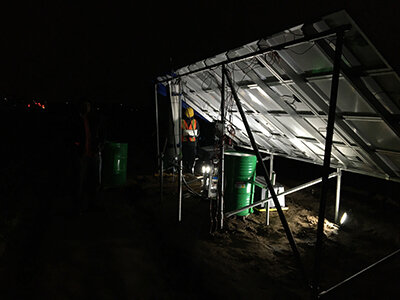 The team fixing the solar panel at night so it would be ready to work in the morning.