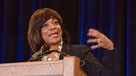 Valerie Montgomery Rice speaking at podium
