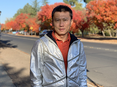 Yi Cui wearing a jacket made from a textile that his research group at Stanford invented.