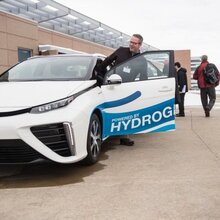 People entering a hydrogen powered car