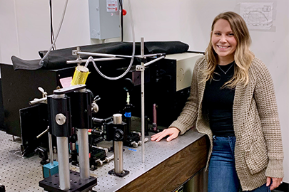 Hannah Rhoda with the resonance Raman spectroscopy equipment